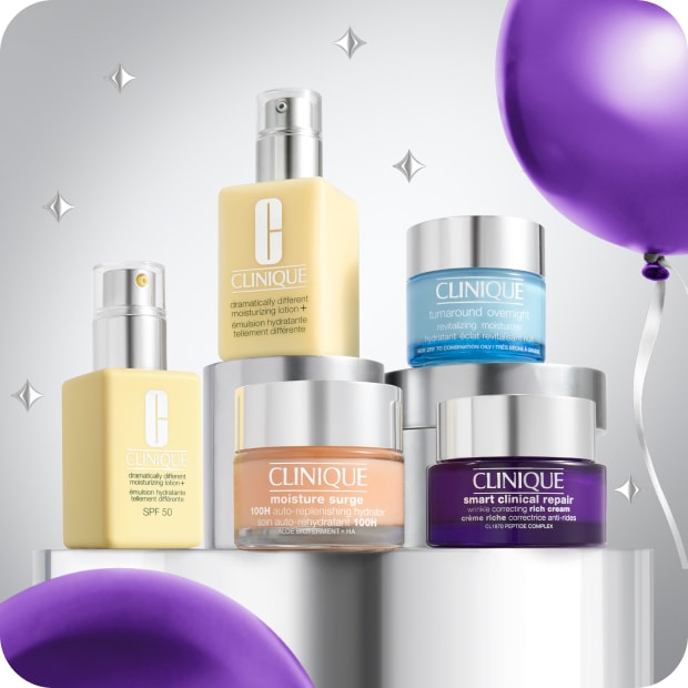 Selection of best-selling Clinique moisturisers products on a grey plinth, surrounded by purple balloons